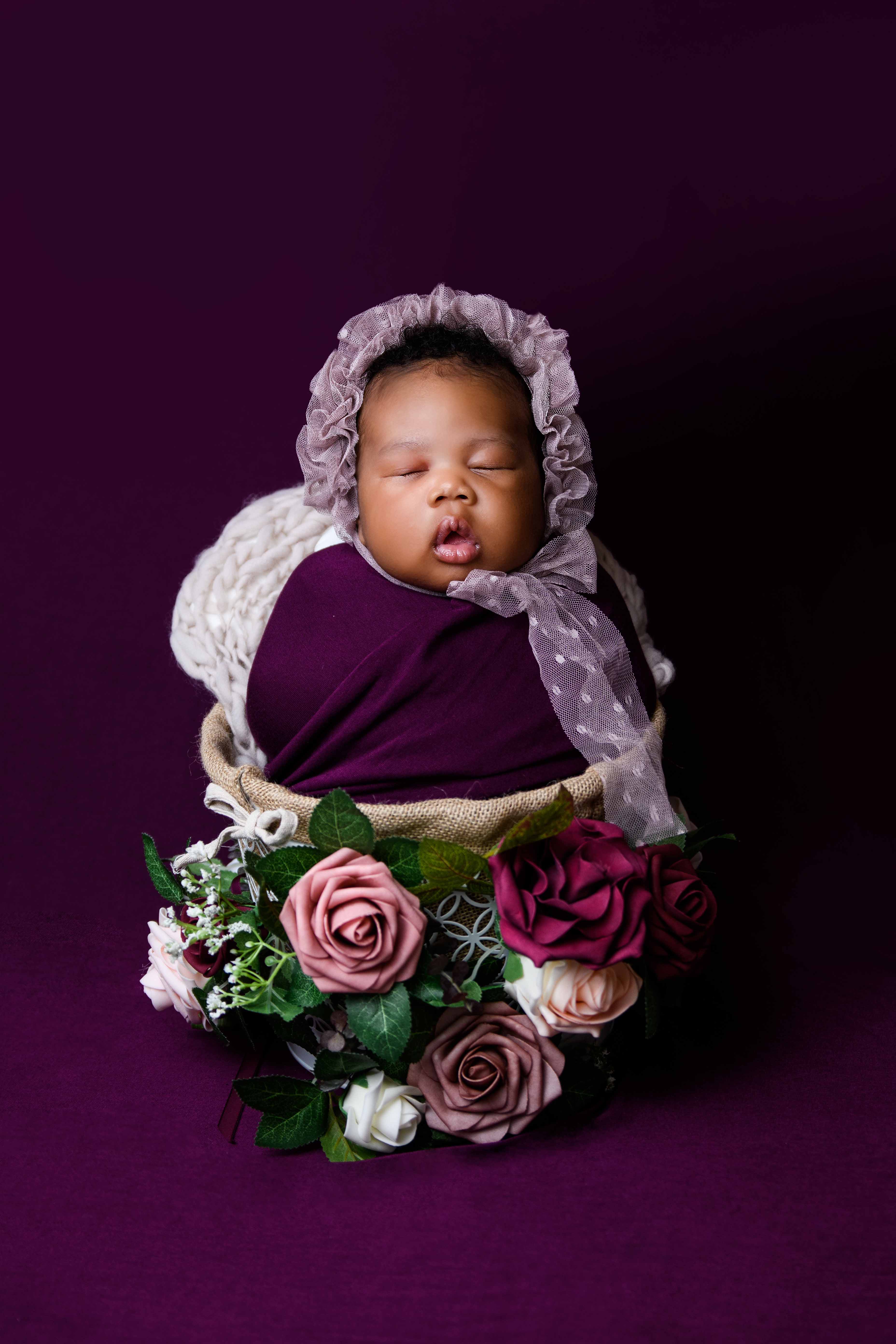 newborn-baby-girl-purple-flowers.jpg