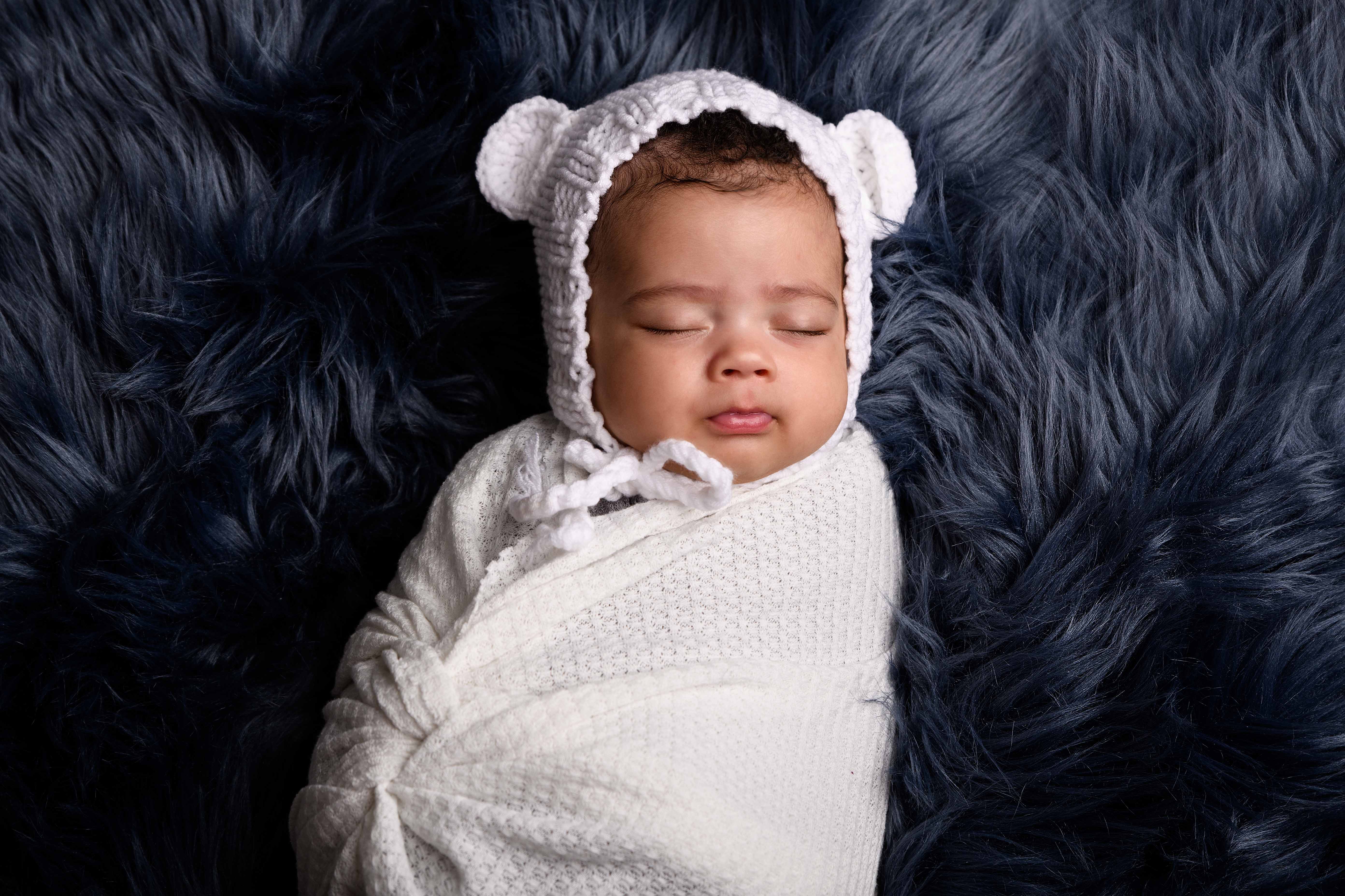 newborn-bay-boy-fluffy-white-outfit.jpg