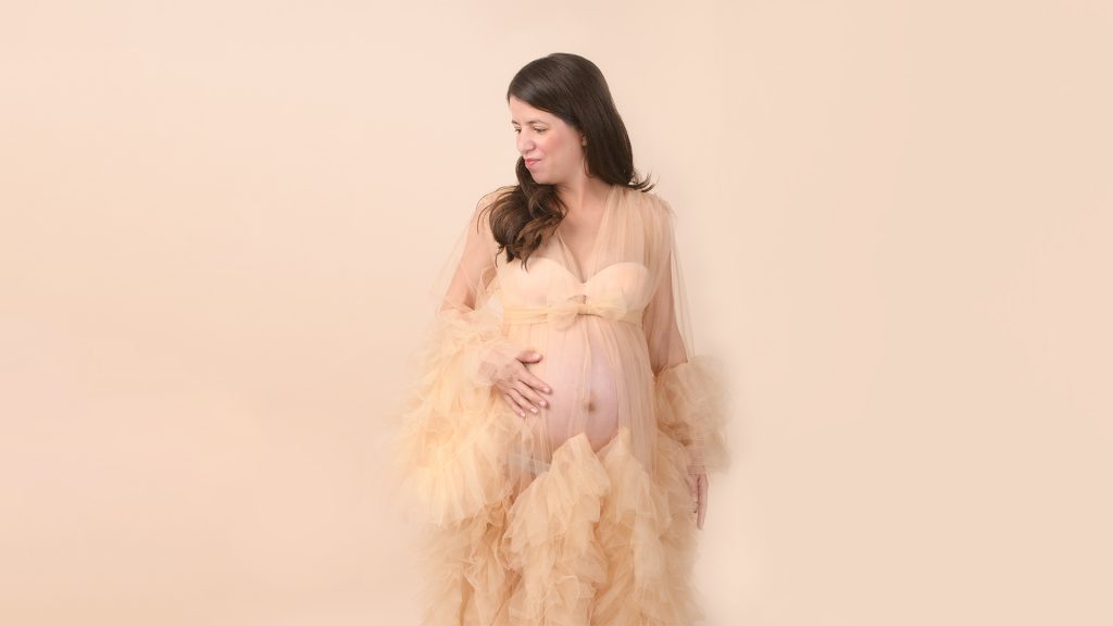 maternity in new jersey in a gold dress